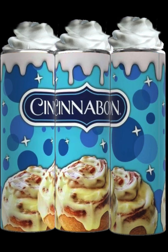 Three Kreative Kreationz Cinnabon 20oz Tumblers with Removable Lid Toppers, designed with whipped cream accents, stand side by side. The blue background showcases the Cinnabon logo and features illustrations of signature cinnamon rolls with icing dripping down the sleek design of each tumbler.