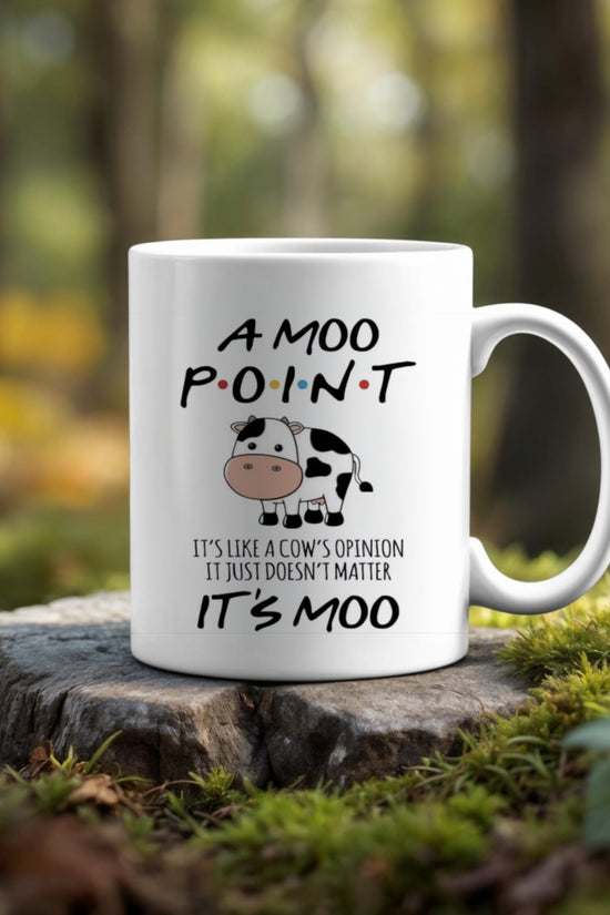 The Friends Moo Point Mug by Kreative Kreationz—a white ceramic mug with a cartoon cow and the quote, 