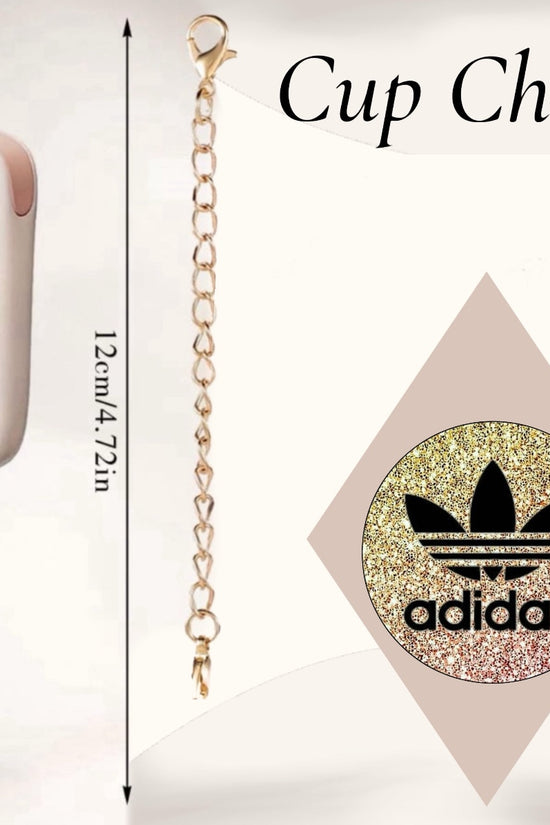 The Adidas Cup Charm by Kreative Kreationz is a handcrafted tumbler charm with a gold chain and round glittery charm featuring a black logo. It measures 12 cm (4.72 inches) and is displayed on a cup handle against a plain background with the text 