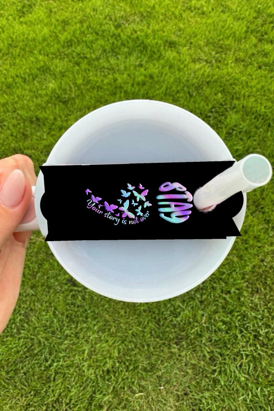 A hand holds a customizable STAY Suicide Awareness Stanley Lid Topper by Kreative Kreationz, featuring a black band with colorful butterflies and the phrase 
