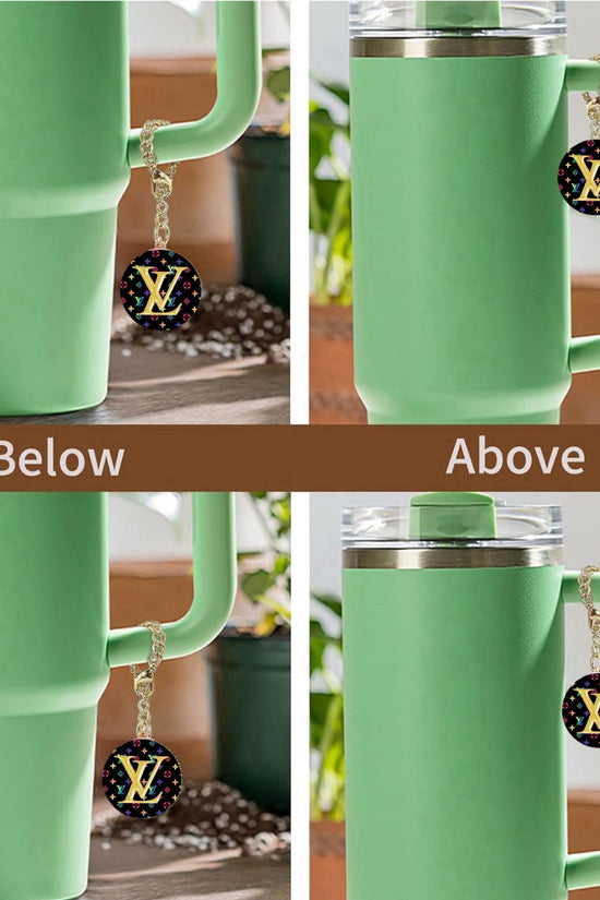 Four images show a light green tumbler with handle, featuring the Kreative Kreationz Louis Vuitton Charm Dangle—a black and gold LV logo keychain on a lobster clasp—attached either below or above the handle as a stylish cup accessory.