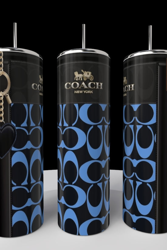 Three sleek Kreative Kreationz (Copy) Coach Blue Red Heart 20oz Skinny Tumblers, featuring stainless steel and blue with red heart design, are displayed on a white surface with silver lids and straws against a black background.
