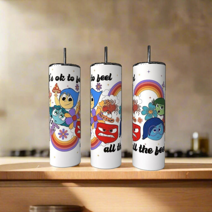 Three Pixar The Feels 20oz Tumblers by Kreative Kreationz, with colorful Inside Out characters and rainbow designs saying “It’s ok to feel all the feels,” make a vibrant addition to your luxury drinkware collection.