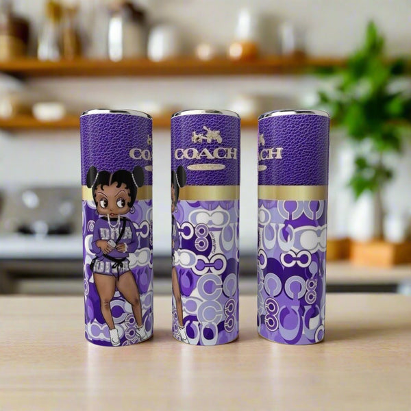 Three Boop Purple 20oz Tumblers by Kreative Kreationz, each featuring Betty Boop art, are displayed on a wooden surface with a blurred kitchen background.