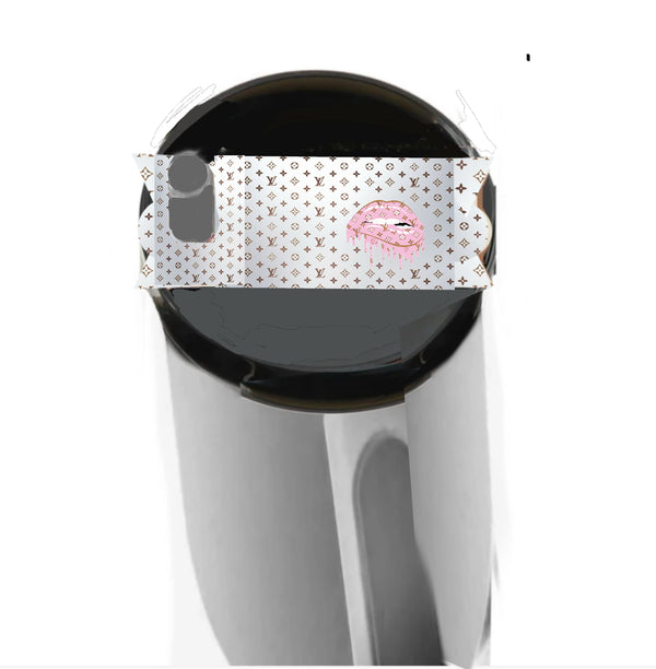 A metallic Stanley lid plate/topper by Kreative Kreationz, named "Louis Vuitton Dripping Lips" in silver, features a Louis Vuitton-inspired pattern and pink lips edited over the opening.