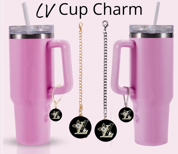 Two pink tumblers with handles, each adorned with a Kreative Kreationz LV Charm Dangle cup accessory—round black and gold charms on chains. "LV Cup Charm" appears above, adding style with unique gold or silver chain designs.