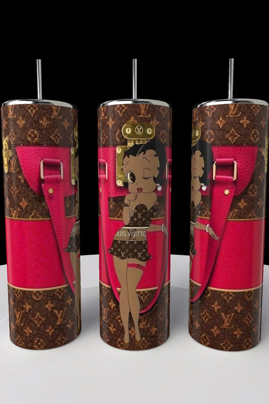 The Betty B Coach 20oz Skinny Tumbler by Kreative Kreationz has black and brown patterns with a cartoon character in swimwear. Featuring pink accents like straps and buckles, it's the perfect quirky addition to your collection.