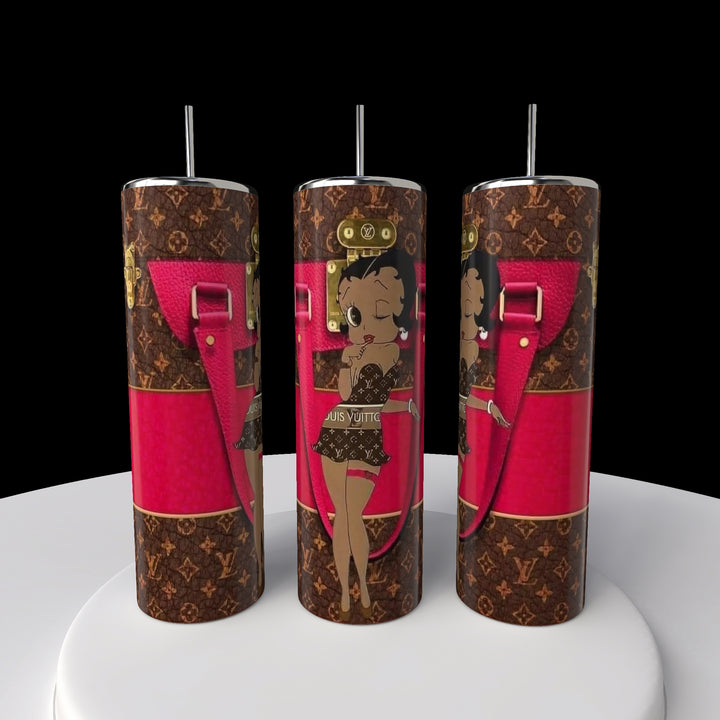 The Betty B Coach 20oz Skinny Tumbler by Kreative Kreationz has black and brown patterns with a cartoon character in swimwear. Featuring pink accents like straps and buckles, it's the perfect quirky addition to your collection.