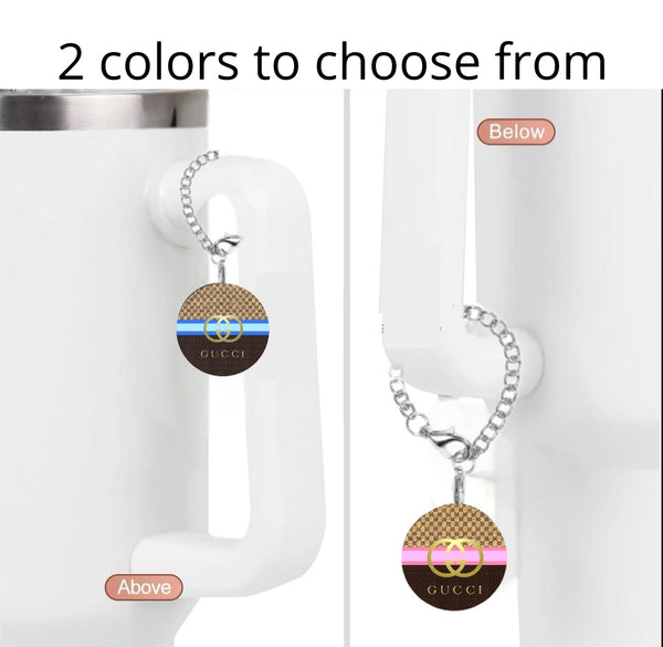 Kreative Kreationz Gucci Blue|Pink Cup Charm: A white mug with a tumbler charm keychain on the handle, available in two styles—blue stripe ("Above") or pink stripe ("Below"). Text above says, "2 colors to choose from.