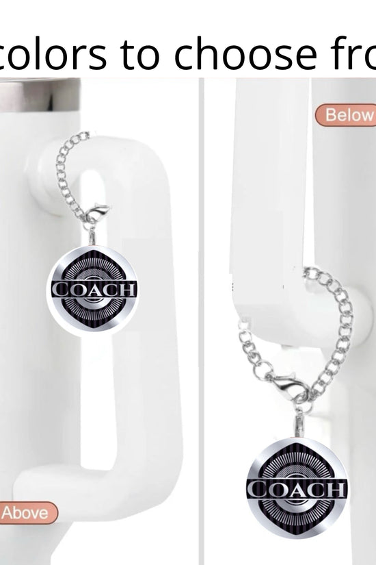 The Coach Charm Dangle by Kreative Kreationz is shown on a white mug handle, displayed above and below the handle. 