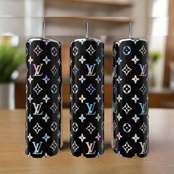 Three LV Inspired Multicolor 20oz Tumblers by Kreative Kreationz, each featuring a glossy black background with luxury-inspired patterns, are shown with metal straws on a wooden surface.