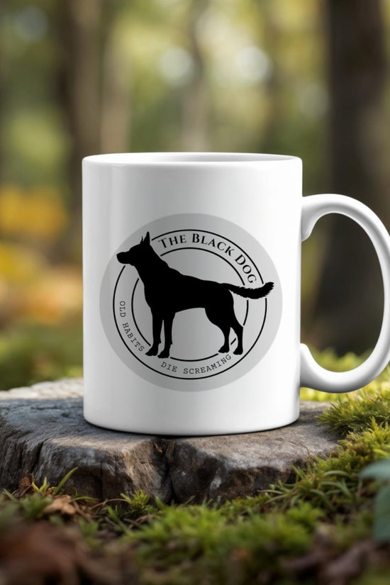 The Black Dog | TTPD -Taylor Swift Mug by Kreative Kreationz features a black dog silhouette and “The Black Dog” text—ideal for unique mug lovers or Taylor Swift fans.