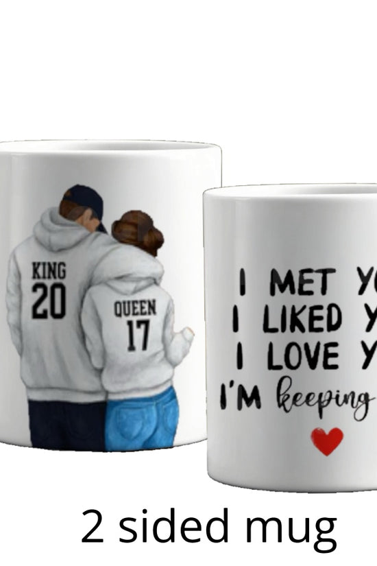 The Couples Ceramic Mug by Kreative Kreationz showcases a hoodie-clad couple with 