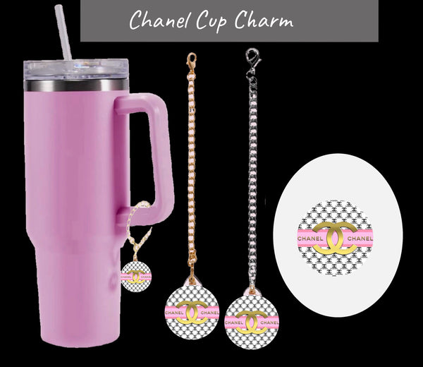 The Chanel Charm Dangle | Cup Accessory by Kreative Kreationz is shown on a pink tumbler with straw, featuring close-ups that highlight its unique pink and gold Chanel-inspired design. Durable and waterproof, it adds flair to your cup.