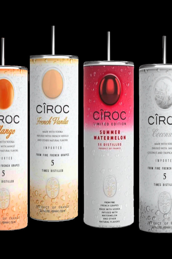 Two cans of Kreative Kreationz Ciroc 20oz Tumbler with 3D Lid Topper are shown on a wooden surface, reminiscent of travel tumblers. The left can is Red Berry flavor, topped with ice and a cherry. The right can is Vodka Snap Frost flavor, topped with ice and a lemon slice. Both cans feature product information and branding.