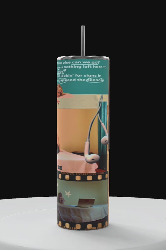Sabrina carpenter tumbler with black background on a white platform rotating in a circle motion counter clockwise showing 360 angle of the wrapped tumbler design