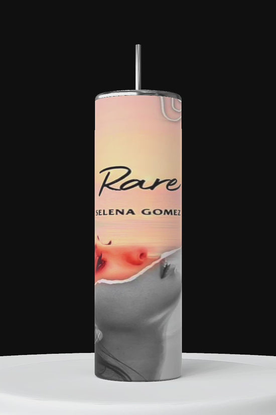 Three tall tumblers are decorated with images of Selena Gomez in different poses; one in a white dress, one with a serious expression, and one in casual attire. The designs, reminiscent of intricate Stanley cups, are embellished with flowers, leaves, hearts, and text like 
