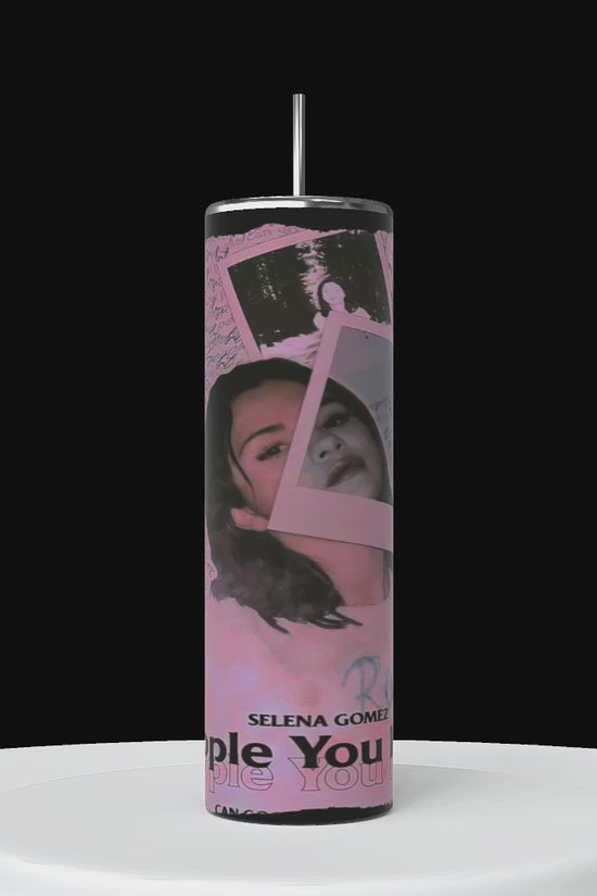 Three tall, tumblers personalized tumblers are shown. the wrapped tumbler features the name 