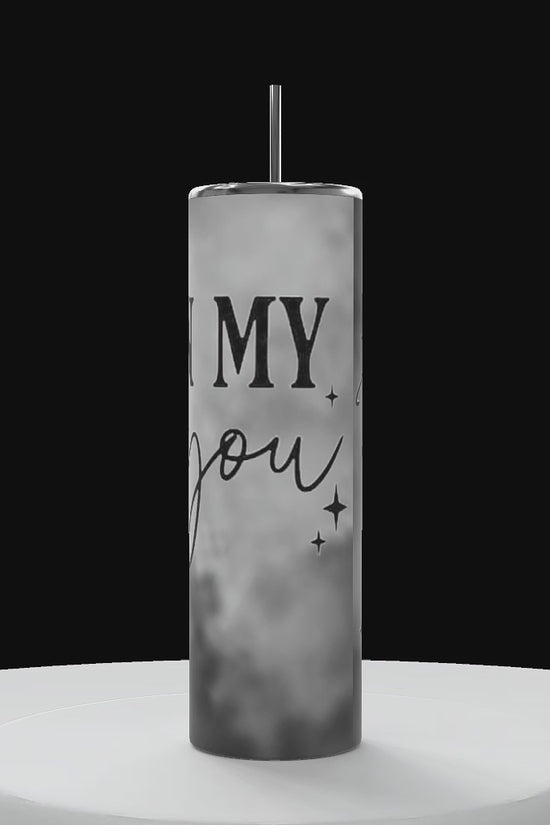 tumbler rotating to show 360 degree angle with black and white clouds that say 